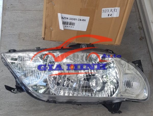đèn pha mazda 323